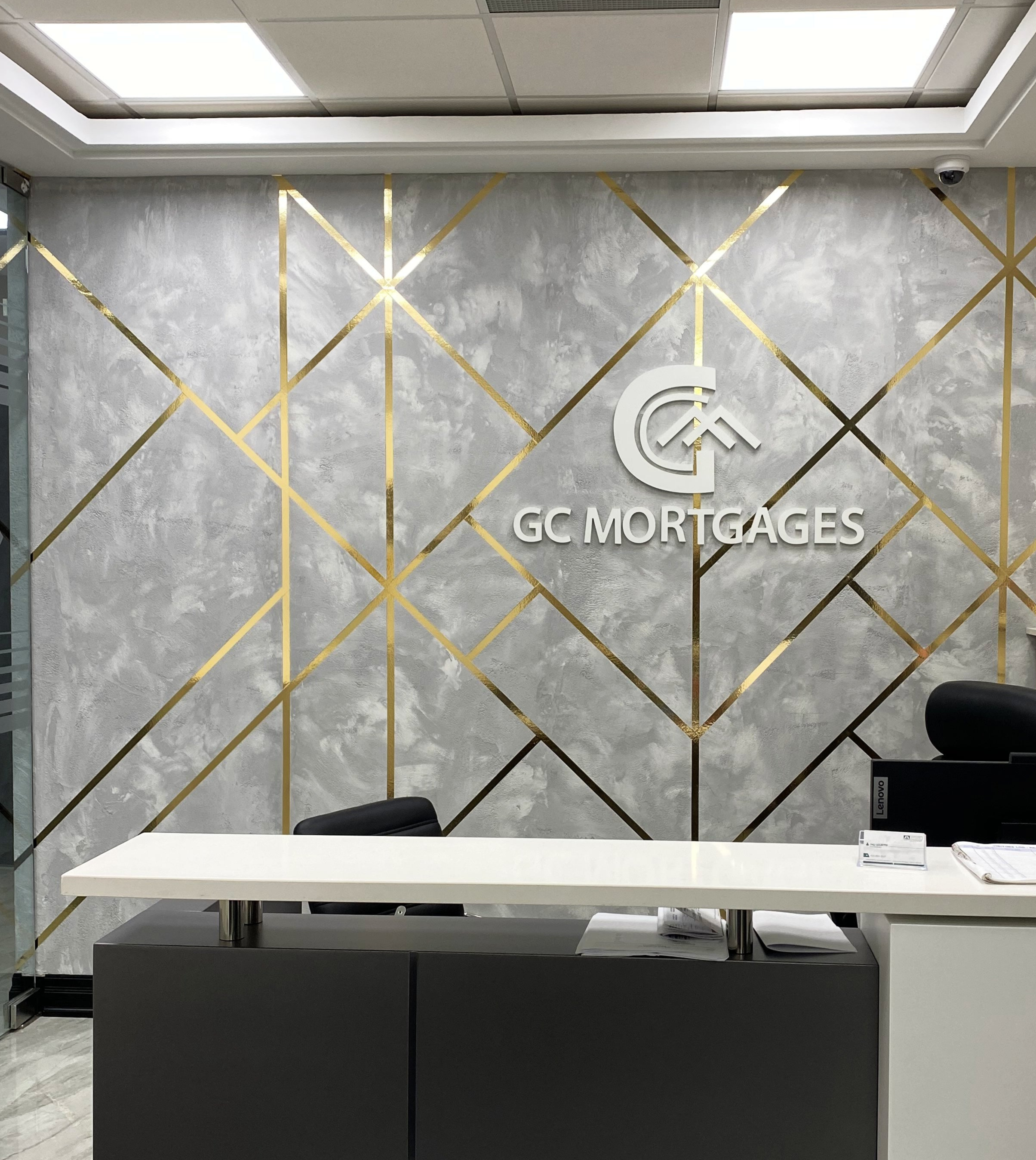 microcement accent wall with company logo